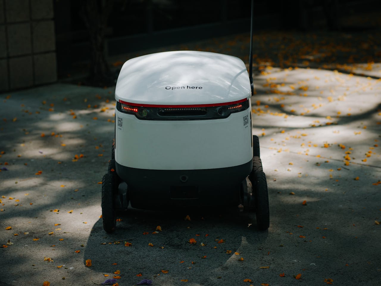about-01 Autonomous delivery robot in urban setting, showcasing modern technology.